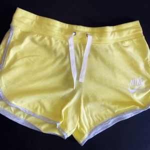 Women yellow Nike shorts